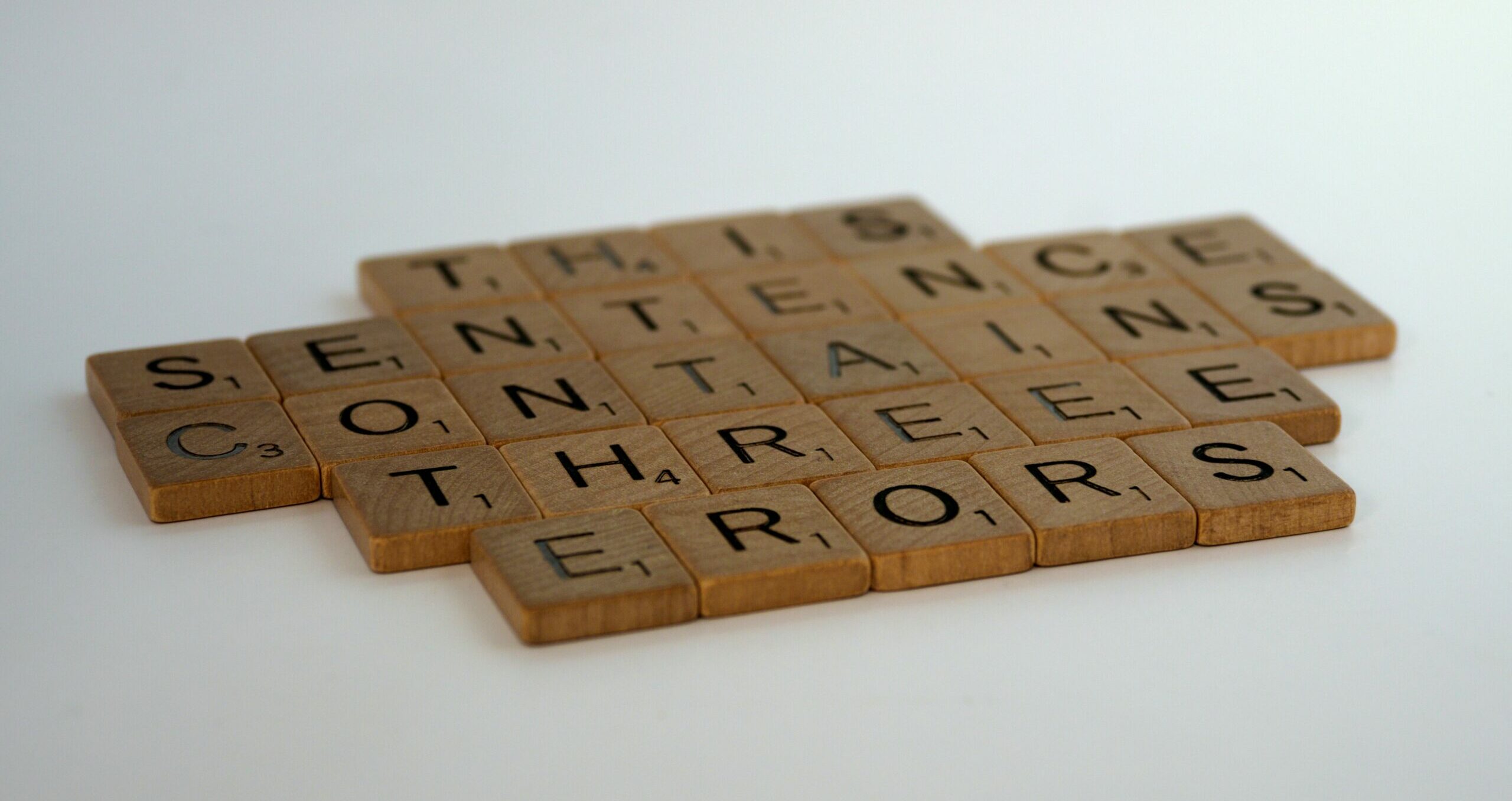scrabble, scrabble pieces, lettering, letters, white background, wood, scrabble tiles, wood, words, this sentence contains three errors, puzzle, riddle, humour, conundrum, quiz,